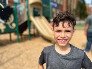 Boy smiling outside