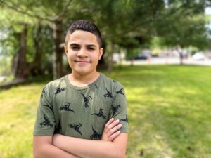 Boy smiling outdoors